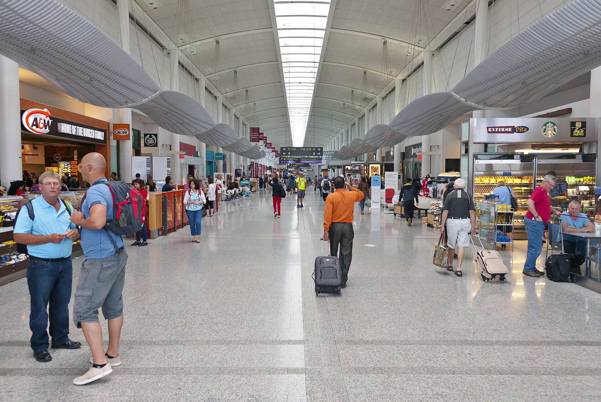 Airport connection signage and gate change board in a major hub.